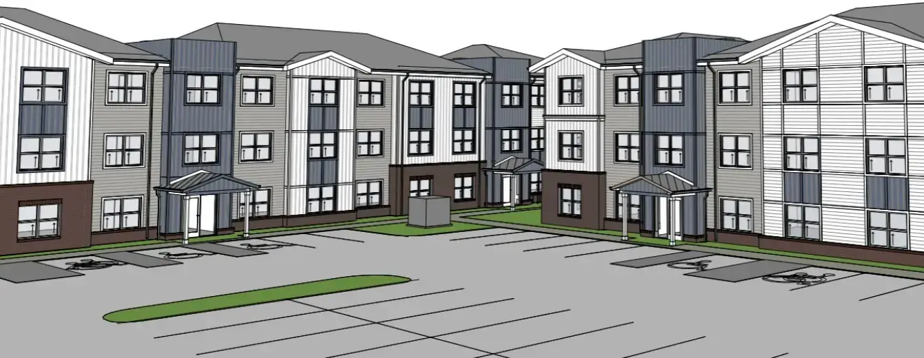 Architectural rendering of a three-story apartment complex with gray and white siding, three entryways, parking spaces, green areas, and designated accessible parking spots in front.